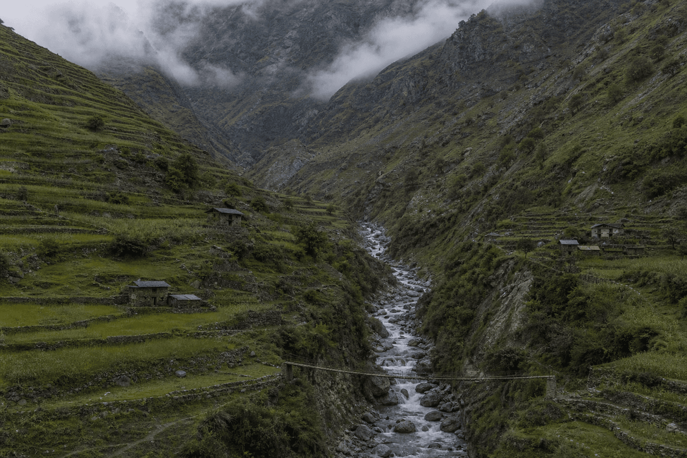 Terraced fields and scattered houses along a steep river gorge in the Sanjala Valley